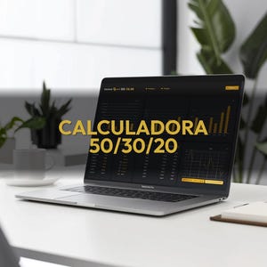 May include: A silver laptop displaying a financial dashboard with the text "CALCULADORA 50/30/20" in gold. The laptop is open on a white desk, with a coffee cup and plant in the background.