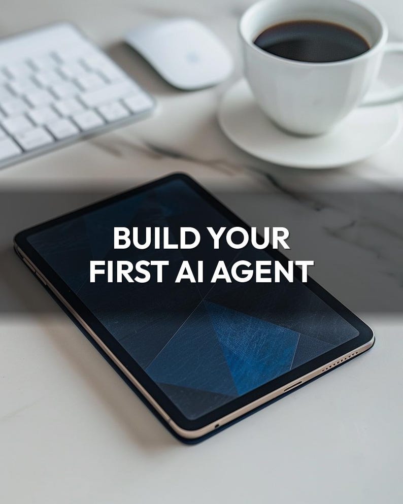 May include: A black tablet with the text "BUILD YOUR FIRST AI AGENT" is the focal point of this image. A white keyboard, mouse, and a cup of coffee on a saucer are also visible. The tablet has a dark blue geometric design on the screen.
