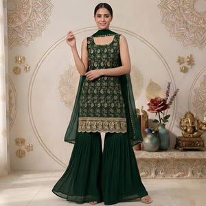 May include: A dark green sleeveless tunic featuring intricate gold floral embroidery and a scalloped hem, paired with matching dark green pleated wide-leg trousers and a coordinating sheer dark green dupatta draped over the shoulders.