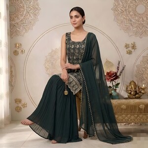 May include: A dark green sleeveless tunic featuring intricate gold embroidery and a scalloped hem, paired with matching dark green pleated wide-leg trousers and a sheer dark green dupatta with a delicate gold-beaded border trim.
