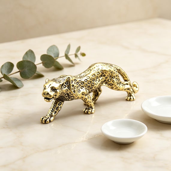 A tiny solid-brass panther sculpture that looks like it belongs in a mid-century collector's study — serious desk presence for under $20.