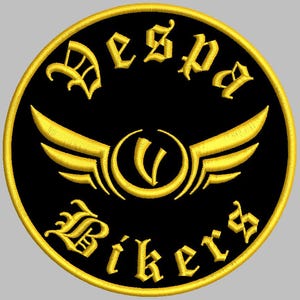 May include: A circular embroidered patch featuring a black background with a gold border. The text "Vespa" is arched at the top and "Bikers" at the bottom in a gothic font. A central gold emblem depicts a stylized letter V with wings.