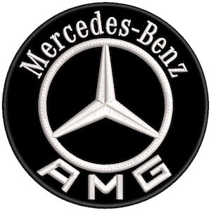 May include: A circular embroidered patch featuring a black background with the white Mercedes-Benz logo in the center. The text Mercedes-Benz is arched along the top edge, and the letters AMG are positioned at the bottom, all in white thread.