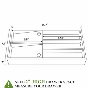 May include: A rectangular drawer organizer with dimensions labeled. The organizer is 15.7 inches long, 7.8 inches wide, and 2 inches high. It features compartments and a warning: "NEED 2" HIGH DRAWER SPACE MEASURE YOUR DRAWER."