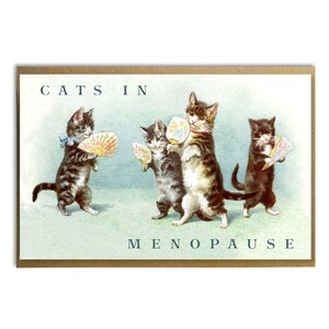 May include: A humorous greeting card with a vintage illustration of four cats holding fans. The text on the card reads "Cats in Menopause".