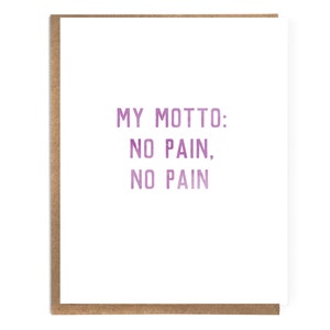 May include: A white card with purple text that reads "MY MOTTO: NO PAIN, NO PAIN".