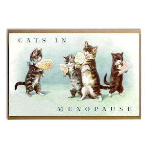 May include: A humorous greeting card with a vintage illustration of four cats holding fans. The text on the card reads "Cats in Menopause".
