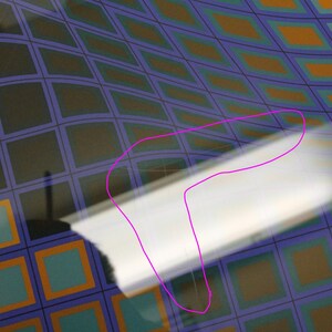 May include: Abstract image featuring a curved surface with a grid pattern in shades of blue, orange, and black. A white, curved object is in the foreground, partially obscuring the grid.
