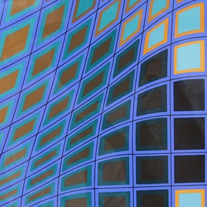May include: Abstract geometric artwork featuring a repeating pattern of diamonds and squares. The design uses a palette of blue, teal, orange, and black, creating a sense of depth and movement. The artwork is set against a white background.