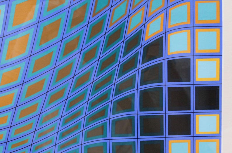 May include: Abstract geometric artwork featuring a repeating pattern of diamonds and squares. The design uses a palette of blue, teal, orange, and black, creating a sense of depth and movement. The artwork is set against a white background.