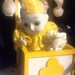 Music Box with porcelain jester clown from San Francisco Music Box Company yellow and white