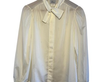 Blusa vintage color crema Alicia de los años 80, con botones, cuello con lazo y mangas abullonadas, talla 10.
