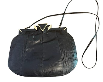 Bolso vintage Sharif Art Deco con cierre de broche, de piel negra con marco repujado de pitón.