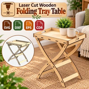 May include: A light-colored wooden folding tray table with a rectangular top and curved X-shaped legs. The design includes cut-out handles on the sides. The image displays text reading Laser Cut Wooden Folding Tray Table and file formats SVG, DXF, EPS, CDR.