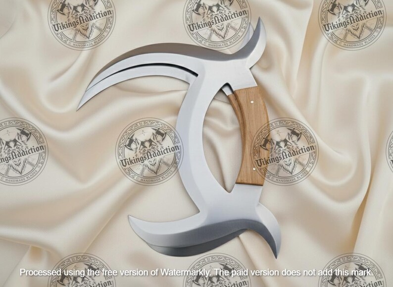 May include: A curved, silver-colored blade with a wooden handle. The blade has a unique shape, with a sharp edge and a curved design. The handle is made of light-colored wood. The item is a handmade blade.