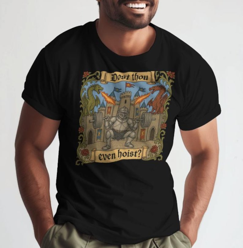 May include: Black t-shirt featuring a medieval-themed graphic. The design includes a knight lifting weights in front of a castle, with dragons and the text "Dost thou even hoist?" in a scroll.