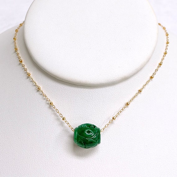 Carved jade bead best sale necklace