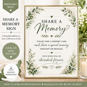 May include: A rectangular sign in a gold frame featuring the text SHARE A MEMORY, PLEASE TAKE A MEMORY CARD AND SHARE A SPECIAL MEMORY, THOUGHT OR MESSAGE. YOUR WORDS WILL BE CHERISHED FOREVER. The design includes green watercolor leaf accents.