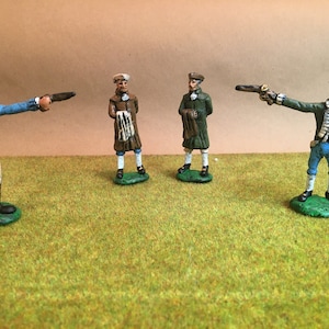 May include: Four miniature figures of men wearing 18th century clothing. The figures are painted in various colors, including blue, green, brown, and white. The figures are holding pistols and are posed in a dramatic fashion.