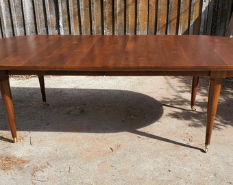 Walnut Extension Table with Tapered Legs and Wheels - Kinda cool!