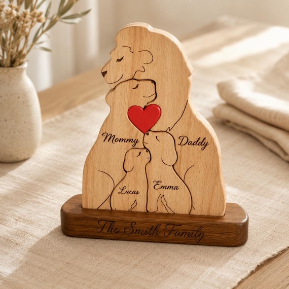 A wooden lion family puzzle where each piece is engraved with a family member's name — it's a puzzle, a name plaque, and a family portrait all in one striking object.