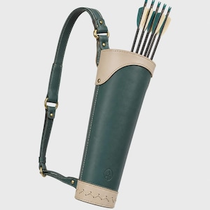 May include: A dark green leather quiver with a beige leather top trim and base featuring decorative stitching. The quiver includes an adjustable dark green shoulder strap with brass-toned hardware and contains five arrows with black shafts and teal fletching.