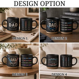 May include: Four sets of two black ceramic mugs with a tan base. Each mug features Star Wars-inspired graphics with lightsabers and the text "THE BEST DAD IN THE GALAXY." Some designs include customizable names next to lightsaber illustrations.