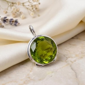 Handmade green peridot pendant crafted in 925 sterling silver.
Natural green peridot gemstone pendant with elegant silver setting.
Sterling silver peridot pendant featuring a vibrant green gemstone.
Handmade peridot jewelry pendant gift for her in 925 silver.
Nature-inspired green peridot pendant with artisan silver craftsmanship.
