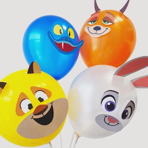 May include: Four colorful balloons with cartoon animal faces. The balloons are blue, orange, yellow, and white. Each balloon has a different animal face printed on it, including a duck, fox, bear, and rabbit. The balloons are inflated and ready for a party.