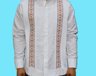 May include: A long-sleeved white button-down shirt featuring two vertical panels of intricate orange and blue geometric embroidery. The shirt includes vertical pleats flanking the embroidered sections, a classic collar, and buttoned cuffs.