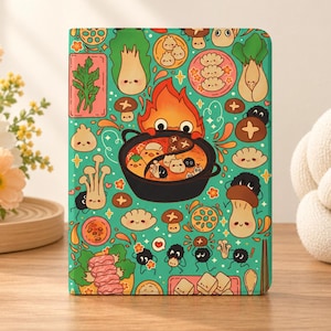 May include: A rectangular notebook with a teal cover featuring a repeating pattern of cartoon food items, including dumplings, mushrooms, leafy greens, and tofu, centred around a black pot of hot soup with a small orange flame character.