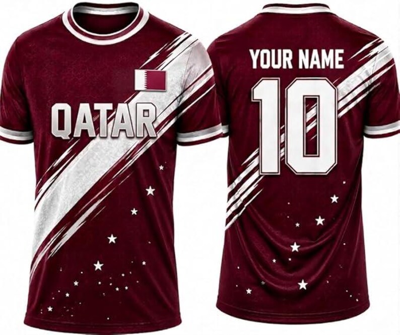 May include: Maroon soccer jersey with white accents and the word "QATAR" across the chest. The jersey features the Qatar flag and a white stripe design. The back displays the number 10 and the text "YOUR NAME".