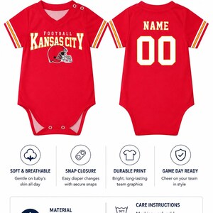 May include: A red baby romper featuring a V-neck, short sleeves with yellow and white stripes, and snap closures. The front displays the text KANSAS CITY FOOTBALL with a helmet graphic. The back shows the text NAME and the number 00 in yellow.