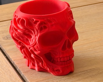Soporte con forma de calavera roja para brochas de maquillaje, bolígrafos y pequeños objetos: un organizador de escritorio único.