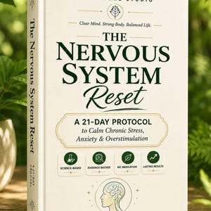 May include: A hardcover book titled "The Nervous System Reset" with the subtitle "A 21-Day Protocol to Calm Chronic Stress, Anxiety & Overstimulation." The cover is cream-colored with green and black text and graphics. The book is a Vitalcore Studio Premium Guide.