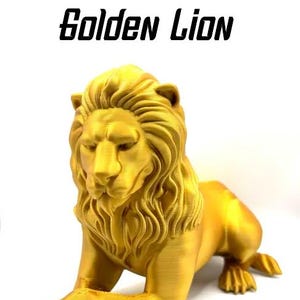 May include: A golden lion statue in a recumbent pose. The lion has a detailed mane and paws, with the text "Golden Lion" above it. The statue is on a white background. The image also includes the logos for "JROSE" and "ARENA BREAKOUT INFINITE".