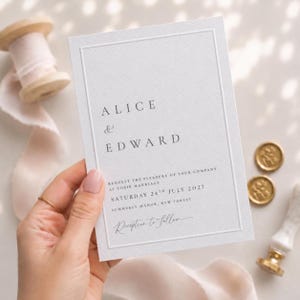 May include: A white rectangular wedding invitation card with a debossed border, featuring the text Alice & Edward, request the pleasure of your company at their marriage, Saturday 24th July 2027, Summerly Manor, New Forest, and Reception to follow.