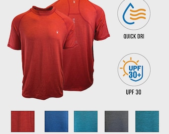 Puede incluir: Una camiseta roja de manga corta y cuello redondo con un pequeño logotipo blanco en el pecho. La imagen incluye iconos de protección QUICK DRI y UPF 30+, junto con muestras de color etiquetadas como Red, Dress Blue, Blue Lagoon, Black y Ocean.