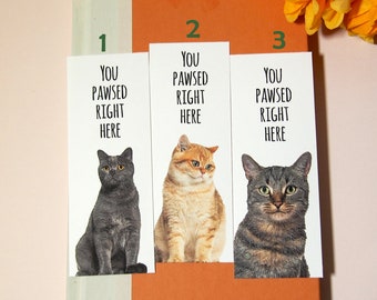 May include: Three cat-themed bookmarks with the text "You pawsed right here" and a different cat on each bookmark. The bookmarks are white with black text and are numbered 1, 2, and 3.