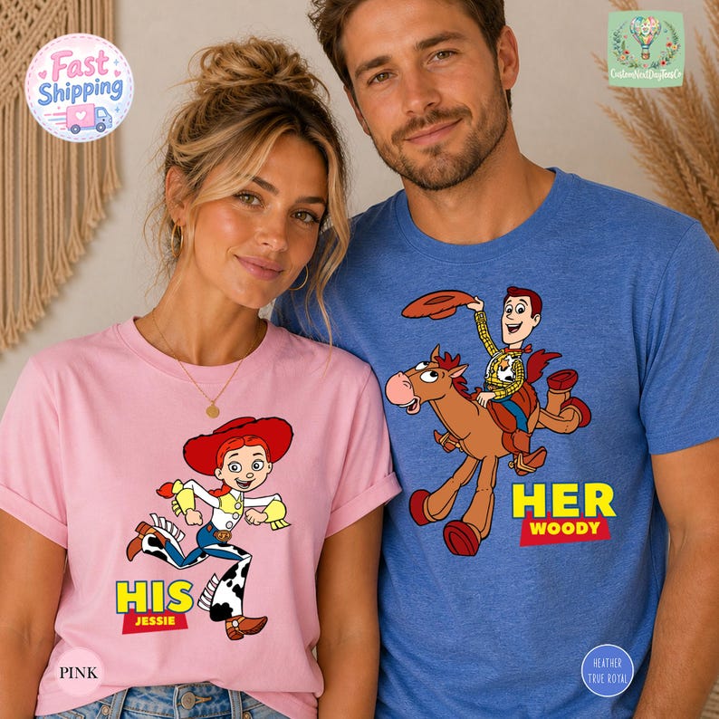 A woman wearing a pink t-shirt with a cartoon character and a man wearing a blue t-shirt with a cartoon character, both featuring the character Woody from Toy Story.
