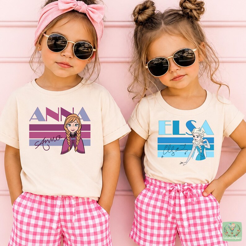 Two young girls wearing sunglasses and t-shirts with the character Anna from the Disney movie Frozen.