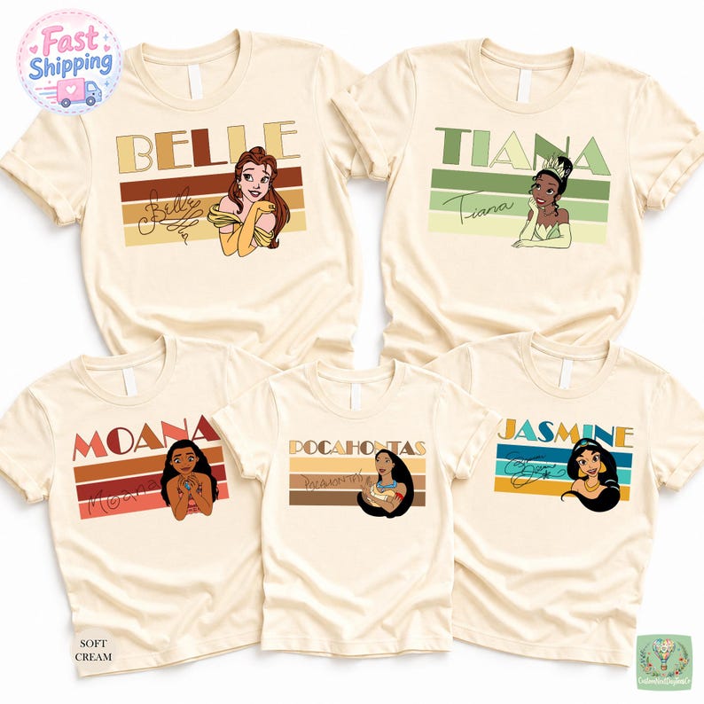 five white t-shirts with Disney princess character designs, including Belle, Tiara, Moana, Pocahontas, and Jasmine.