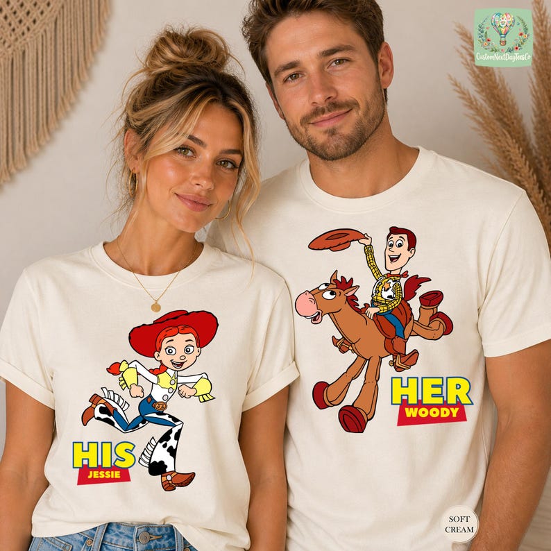 A man and a woman wearing white t-shirts with cartoon characters from the Toy Story franchise.