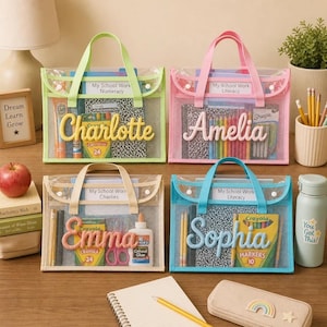 May include: Four rectangular clear plastic zipper pouches with handles, each personalized with a raised name in script: Charlotte, Amelia, Emma, and Sophia. The pouches contain school supplies like notebooks, crayons, markers, and glue bottles.