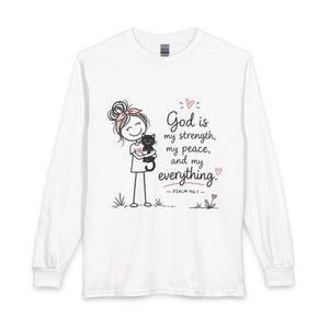 May include: White long-sleeve shirt featuring a cartoon illustration of a person holding a black cat, with the text "God is my strength, my peace, and my everything." Psalm 46:1 is also printed on the shirt.