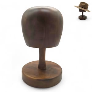 May include: A wooden hat stand with a rounded top, a slender stem, and a circular base. The stand is made of dark brown wood and is designed to display hats. A smaller hat stand with a hat is in the background.