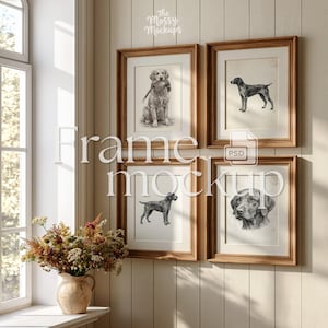 May include: Four framed dog art prints in a light wood frame. The prints feature detailed pencil sketches of different dog breeds. The wall is painted white with vertical wood paneling. The text "Frame Mockups" is overlaid on the image.