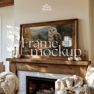 May include: A framed artwork featuring an owl in a forest setting, displayed above a fireplace. The frame is a dark wood, and the artwork has warm tones. The fireplace mantel is decorated with small pumpkins and candle holders. The text "Tv Frame Mockup" is overlaid on the image.