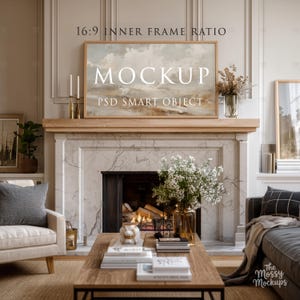 May include: A living room interior with a large framed landscape painting above a fireplace. The painting is labeled "MOCKUP" and "PSD SMART OBJECT". The room features a wooden coffee table, a sofa, and a chair.