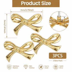 May include: Three polished gold-coloured bow-shaped decorative hardware pieces. Each bow measures 7cm wide and 5cm high. The product is made of solid brass and is easy to install. The package includes 3 bow pieces.